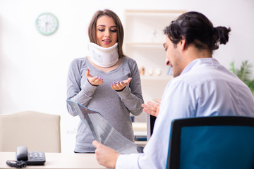 Young male doctor and female beautiful patient