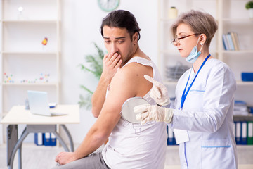 Fototapeta premium Young patient visiting doctor in hospital