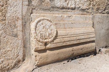 The remains of decorative stone carvings on the wall near the Temple Mount near the Dung Gate in...