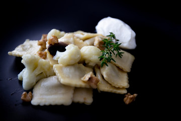 Mushroom ravioli with garlic, walnuts, ricotta and thyme