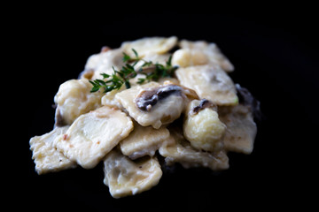 Mushroom ravioli with garlic, walnuts, ricotta and thyme
