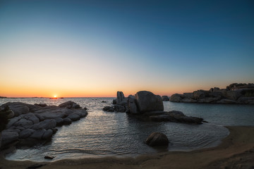 Dawn breaking over beach at Cavallo island in Corsica