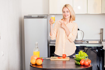 Young woman cooking in the kitchen