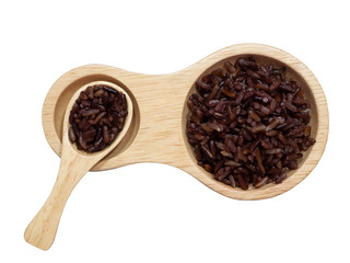 Cooked brown rice or riceberry rice attractive to eat  in wooden spoon and wooden dish isolated on white background.herb,cereal, top view and close up.Take photo at studio.