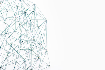 A large grid of pins connected with string. Communication, technology, network concept