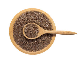 Flaxseed or linseed in wooden spoon on the wooden tray isolated on white background.Herb, cereal, Top view.