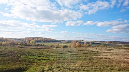 Beautiful landscape panorama on the autumn field and forest in the countryside