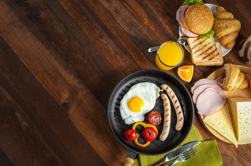 Fried sausage with eggs and vegetables