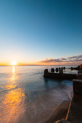 Sunrise view of Coogee beach with the pool on the side.