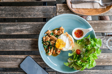  Basil Chicken Rice with Fried Egg  top view on the table