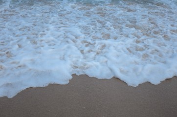 Beach waves and foam at Andaman sea in monsoon season. View for background.