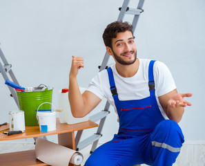 Repairman doing renovation repair in the house with paper wallpa