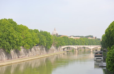 Tevere river cityscape San Pietro basilica in background  Rome Italy