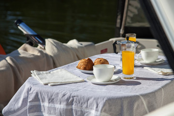 Romantic breakfast on motor yacht