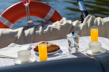 Romantic breakfast on motor yacht