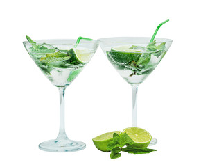 Two beautiful glasses with mojito and tubules. Isolated on white. Mint, rum, lime.