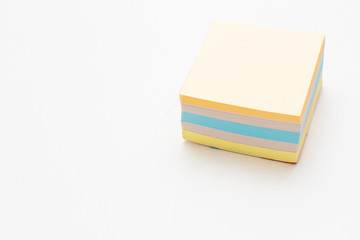 multicolored stack of stickers on a white background