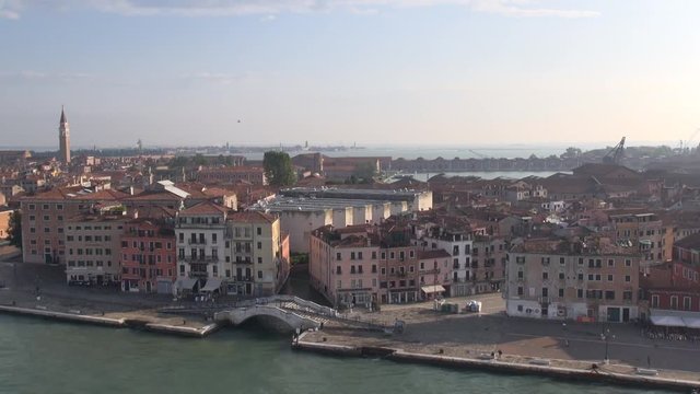 Time lapse of Venice, Italy: 1 minute-fly along waterfront  with Campanile, Grand Canal, Basilica di Santa Maria della Salute, Doges Palace and Piazza San Marco (view from a cruise liner)
