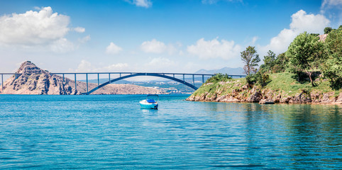 Colorful summer view of bridge to Krk island. Sunny morning scene of Croatia, Europe. Beautiful world of Mediterranean countries. Traveling concept background.