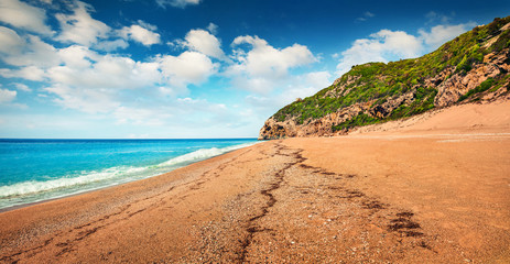 Panoramic spring view of Kathisma Beach. Bright morning seascape of Ionian sea. Amazing outdoor scene of Lefkada Island, Greece, Europe. Beauty of nature concept background.