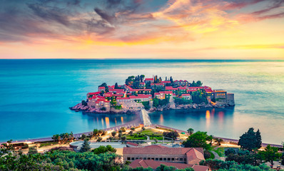 Aerial summer cityscape of Sveti Stefan town. Incredible evening seascape of Adriatic sea,...