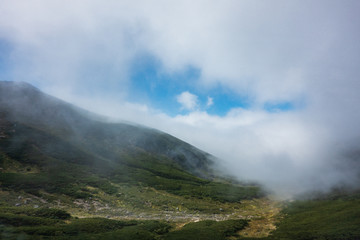 Mt. Norikura wrapped in clouds in Nagano, Japan