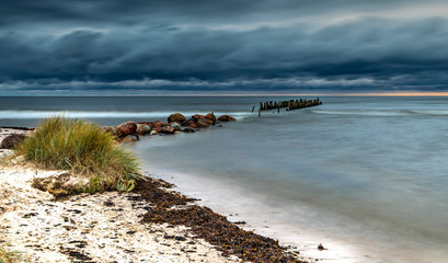 First autumnal storm at the Baltic Sea in remote coastal location, here traditional marine...