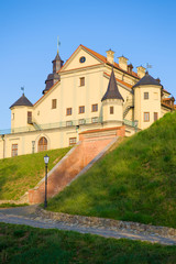 Fototapeta na wymiar Sunny May morning at the walls of old Nesvizsky Castle. Belarus