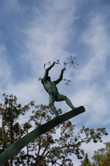 Sculpture of a boy and snowflakes in the Milesgarden park. Stockholm. Sweden 08.2019