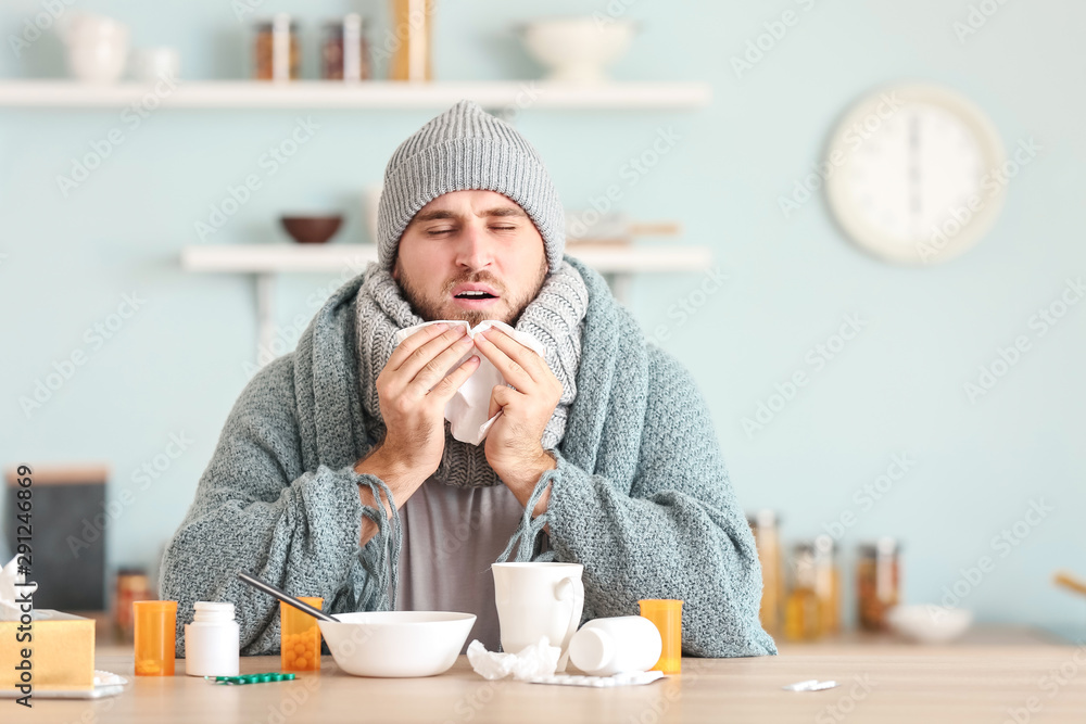 Sticker Sick man sitting at kitchen table