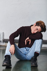 drunk guy looking at the camera, full length photo. people, health problem