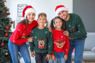 Fototapeta premium Happy family at home on Christmas eve