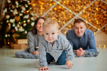 portrait of a boy in the background near the Christmas tree