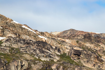 Detail of a cliff in the fjord Skjoldungen, a coastal island in the southeastern shores of Greenland. It is located between two fjords, the Southern Skjoldungen Fjord.