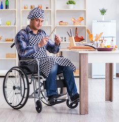 Disabled young man husband working in kitchen