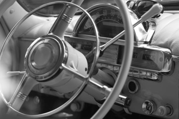 beautiful steering wheel and dashboard design of a retro car