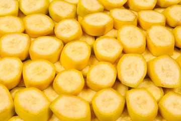 Fresh banana slices background. Top view.