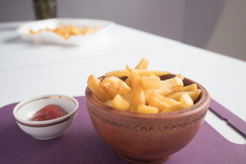 top view of french fries with ketchup on plate