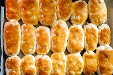 Hot cakes stuffed on a baking sheet