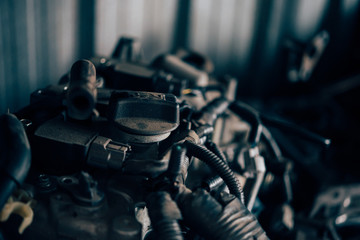 Fototapeta na wymiar Disassembled car dirty engine cylinder at garage
