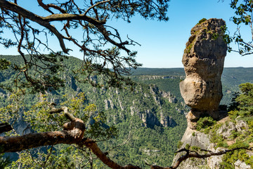 This rock in balance, called the Vase de Sèvre, overlooks the valley of the river Jonte