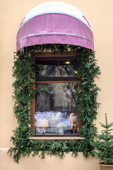 Window with canopy and decorated fir branches, christmas holidays decor