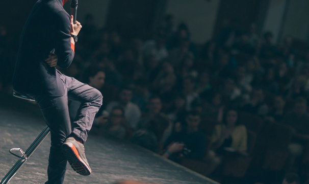 business coach delivers a report to the audience in the conference room