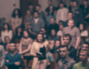 audience and media representatives in the conference room