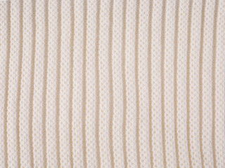 White knitting pink wool texture background. Close up