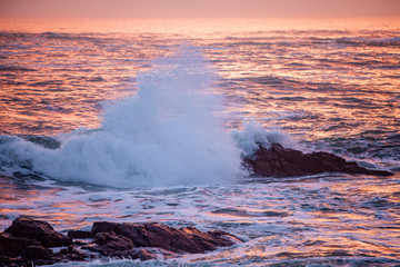 Beautiful ocean waves at sunset on the Brittany coastline in Noth of France