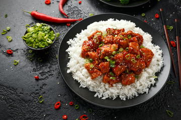 Tso's chicken with rice, green onion and broccoli