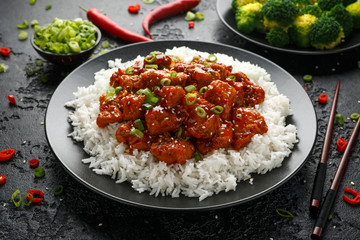 Tso's chicken with rice, green onion and broccoli