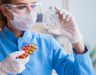 Female scientist researcher conducting an experiment in a labora
