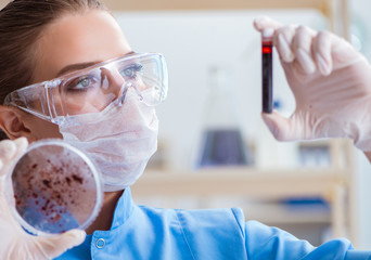 Female scientist researcher conducting an experiment in a labora